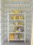 46 - Sissy Yellen, Bright and cheerful nursery decor featuring whimsical yellow tulip wallpaper, a white children’s bookshelf organized with books, playful stuffed animals, and yellow accents, creating a vibrant and fun children’s room that is both stylish and functional.