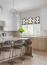 51 - Sissy Yellen, Modern kitchen design featuring a custom kitchen island with houndstooth barstools, sleek pendant lighting, light wood cabinetry, and patterned Roman shades, creating a bright and airy space with minimalist decor.
