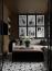 53 - Sissy Yellen, Stylish living room design featuring a gallery wall with black-and-white photos, a cozy seating area with a plush upholstered ottoman, a contemporary patterned area rug, and an orchid centerpiece, complemented by built-in shelving and a sophisticated neutral color palette.
