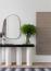 54 - Sissy Yellen, Modern entryway design featuring a contemporary console table with a black and white base, an asymmetrical wall mirror, greenery in a glass vase, minimalist decor elements, and a striped area rug, complemented by artistic wall decor in a neutral and black color palette